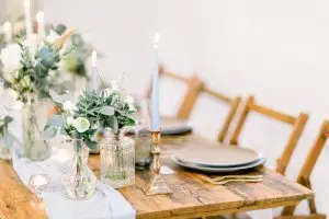 Wedding Table with table runner and bud vases filled with flowers | Essex Wedding Planner