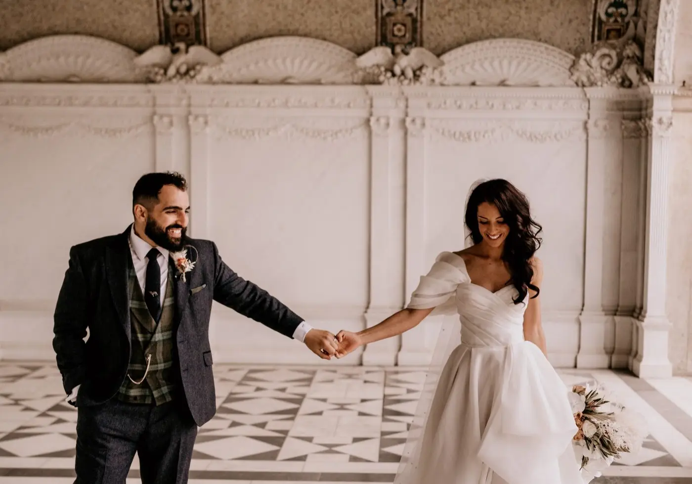 Elegant bride and groom holding hands | UK Luxury wedding