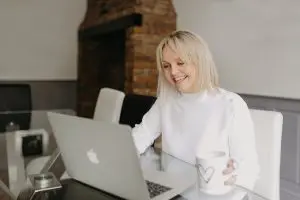 Essex wedding planner Hayley Jayne Weddings & Events working on laptop