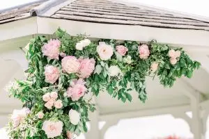 Pink Flowers on wedding gazebo | Essex Wedding Planner