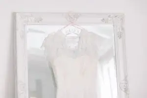 Wedding dress, hanging on a full length mirror | Essex Wedding Planner